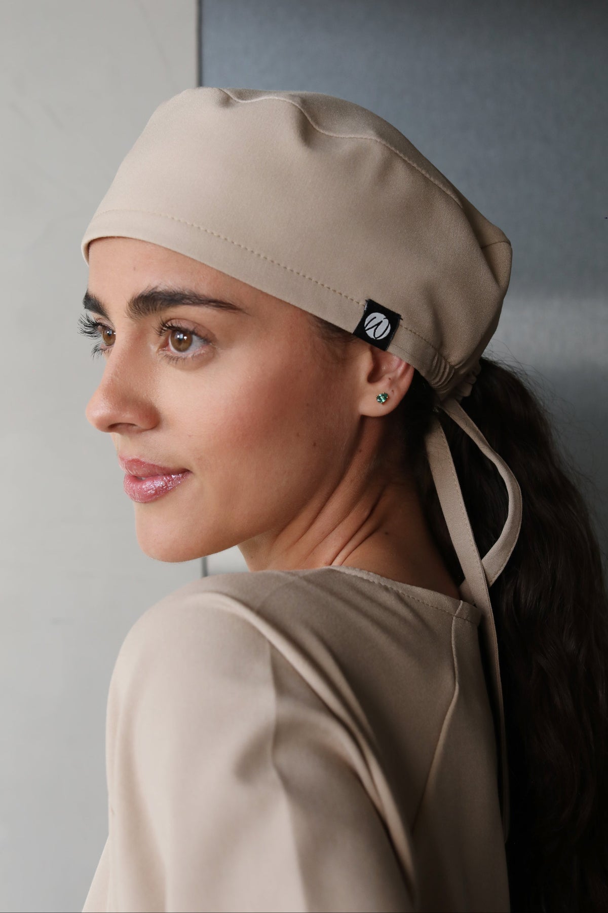 Side view of woman wearing Black Women’s Surgical Cap
