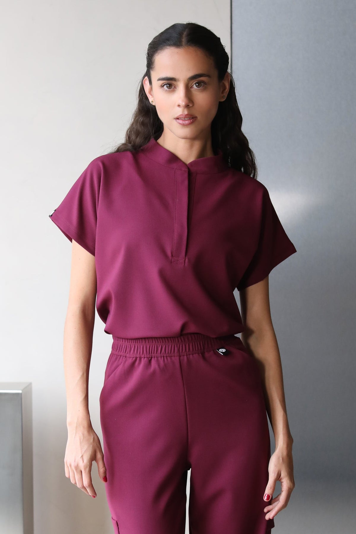 Side view of Glam Burgundy Scrub Top showing the relaxed fit